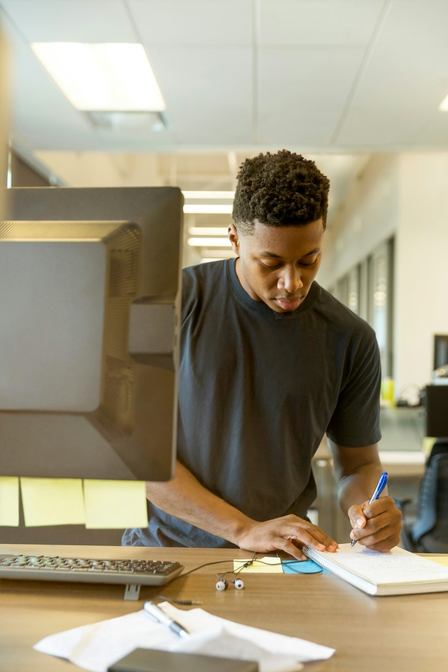 Researcher reading old documents at a library desk